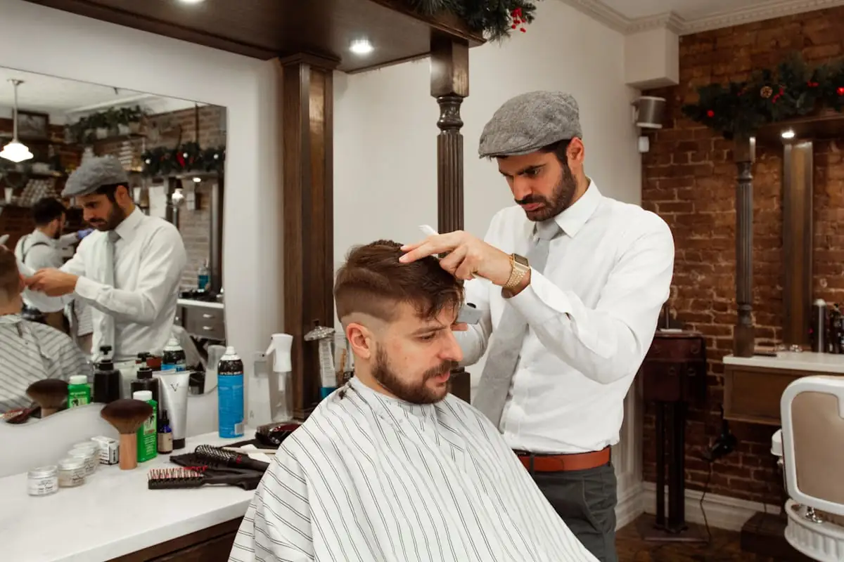Barber styling a client in a modern barbershop